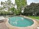 The back yard features a beautiful lagoon style pool with a stone waterfall at 1126 Concord Rd, Davidson, NC 28036
