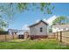 Fenced backyard featuring well-maintained lawn and a cozy deck, perfect for outdoor living and entertaining at 113 Mcgill Nw Ave, Concord, NC 28025