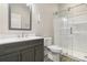 Modern bathroom with a stylish vanity, toilet, and a glass-enclosed shower at 113 Mcgill Nw Ave, Concord, NC 28025