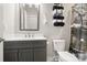 Bathroom featuring a modern vanity, toilet, and stylish fixtures at 113 Mcgill Nw Ave, Concord, NC 28025
