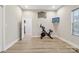 Bedroom featuring modern artwork, an exercise bike, and a television at 113 Mcgill Nw Ave, Concord, NC 28025