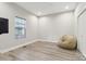 Bright bedroom with hardwood flooring, a large window, and a comfy beanbag chair at 113 Mcgill Nw Ave, Concord, NC 28025