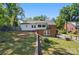 Spacious backyard featuring a brick wall, grassy area, and fenced perimeter at 113 S College St, Monroe, NC 28112