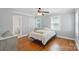 Inviting bedroom with an ensuite bathroom and hardwood floors at 113 S College St, Monroe, NC 28112