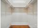 Walk-in closet with adjustable shelving and storage space at 113 S College St, Monroe, NC 28112