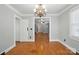 Dining room with hardwood floors and open doorway at 113 S College St, Monroe, NC 28112