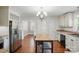 Open kitchen with stainless steel refrigerator and a butcher block island at 113 S College St, Monroe, NC 28112