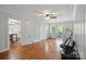 Spacious living room with hardwood floors and white wood paneling at 113 S College St, Monroe, NC 28112