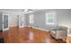 Spacious living room with hardwood floors and large windows at 113 S College St, Monroe, NC 28112