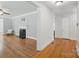 Bright living room boasting hardwood floors, fireplace, and neutral paint at 113 S College St, Monroe, NC 28112