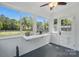 Cozy sunroom with large windows that offer natural light and view to the exterior at 113 S College St, Monroe, NC 28112