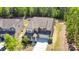 Stunning aerial view of a two-story home with a well-manicured lawn and mature trees at 1176 Shiloh Bend Trl, Fort Mill, SC 29715