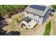 Aerial view of home with solar panels, patio area, playset, fire pit, and landscaping at 1176 Shiloh Bend Trl, Fort Mill, SC 29715