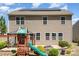 Enjoy this home's backyard featuring a playground, built in fire pit and solar panels at 1176 Shiloh Bend Trl, Fort Mill, SC 29715