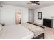 Bright bedroom with ceiling fan, carpet floors, and view into adjacent bathroom at 1176 Shiloh Bend Trl, Fort Mill, SC 29715