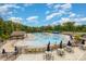 Enjoy the community pool with plenty of seating, shady spots, and a great view at 1176 Shiloh Bend Trl, Fort Mill, SC 29715