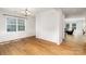 Open dining room featuring hardwood floors, wainscoting, and natural light at 1176 Shiloh Bend Trl, Fort Mill, SC 29715