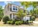 Charming front exterior with manicured landscaping, stone accents, and a two-car garage at 1176 Shiloh Bend Trl, Fort Mill, SC 29715