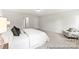 Well-lit main bedroom featuring plush carpeting and a cozy sitting area at 1194 Links Crossing Dr # 163P, Monroe, NC 28112