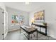 Bright home office with ample natural light, modern desk, and stylish decor, ideal for remote work at 1194 Links Crossing Dr # 163P, Monroe, NC 28112