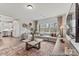 Spacious living room featuring a large sectional sofa, a neutral color palette, and dark wood floors at 1198 Links Crossing Dr # 162P, Monroe, NC 28112