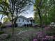 Picturesque backyard featuring a deck, garden, and serene natural surroundings at 121 General Pemberton St, Stanley, NC 28164
