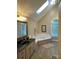 Bright bathroom with a skylight, corner tub, and vanity with plenty of counter space at 121 General Pemberton St, Stanley, NC 28164