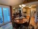 Charming dining area with hardwood floors, and easy access to the kitchen and outdoor patio at 121 General Pemberton St, Stanley, NC 28164