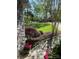 Beautiful front yard featuring a stone walkway and lush landscaping leading to a lovely home at 121 General Pemberton St, Stanley, NC 28164