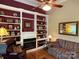 Inviting living room with fireplace, custom built-ins, and hardwood flooring at 121 General Pemberton St, Stanley, NC 28164