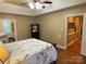 Serene main bedroom with a cozy feel, hardwood floors, and adjacent bathroom at 121 General Pemberton St, Stanley, NC 28164