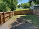 Private backyard with full wood fence and grass area, perfect for outdoor enjoyment at 121 W 11Th St, Oakboro, NC 28129