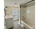 Well-lit bathroom featuring a tub, shower, and vanity with modern finishes at 121 W 11Th St, Oakboro, NC 28129