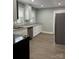 Well-lit kitchen features stainless appliances, granite countertops, and white cabinets at 121 W 11Th St, Oakboro, NC 28129