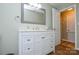 Bathroom featuring a new white vanity, updated flooring, and a doorway to another room at 1222 Glenarden Dr, Rock Hill, SC 29730