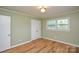 Bedroom with updated laminate flooring, fresh neutral paint and ample sunlight at 1222 Glenarden Dr, Rock Hill, SC 29730