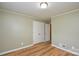 This bedroom features a spacious closet, complemented by modern laminate flooring and neutral paint at 1222 Glenarden Dr, Rock Hill, SC 29730