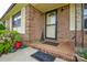 Inviting front porch featuring brick facade, decorative accents, and a welcoming entrance at 1222 Glenarden Dr, Rock Hill, SC 29730