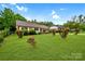 Charming single-story home with a well-manicured lawn and mature landscaping at 1222 Glenarden Dr, Rock Hill, SC 29730