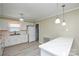 Bright kitchen with white cabinets, a breakfast bar, and modern lighting, offering a functional and inviting space at 1222 Glenarden Dr, Rock Hill, SC 29730