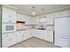 Modern kitchen features white cabinets, sleek countertops, and stainless steel appliances, offering a stylish cooking space at 1222 Glenarden Dr, Rock Hill, SC 29730