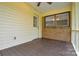 Open-air porch featuring wood floors and a brick exterior, ideal for relaxing outdoors at 1222 Glenarden Dr, Rock Hill, SC 29730