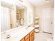 Bathroom features double sink vanity, tiled floor and bathtub with shower at 123 Coachman Loop, Statesville, NC 28625