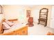 Cozy bedroom with a daybed, chair, and a curated display shelf at 123 Coachman Loop, Statesville, NC 28625