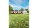 Charming home with a spacious front yard, well-manicured lawn, and inviting curb appeal at 123 Coachman Loop, Statesville, NC 28625