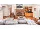 Cozy living room featuring a brick fireplace, hardwood floors, built-in shelving, and comfortable seating at 123 Coachman Loop, Statesville, NC 28625