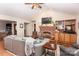 Inviting living room with vaulted ceilings, brick fireplace, and hardwood floors at 123 Coachman Loop, Statesville, NC 28625