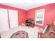 Cozy red-walled music room with pianos, organ, guitar, and a decorative rug at 123 Coachman Loop, Statesville, NC 28625