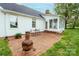 Outdoor patio area with brick paving, garden view and casual seating at 123 Coachman Loop, Statesville, NC 28625