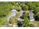 Aerial view of a neighborhood showcasing mature trees and well-maintained properties at 12435 Mallard Dr, Charlotte, NC 28269